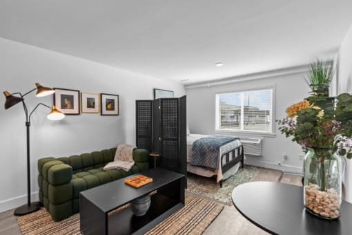 a living room with a couch and a bed